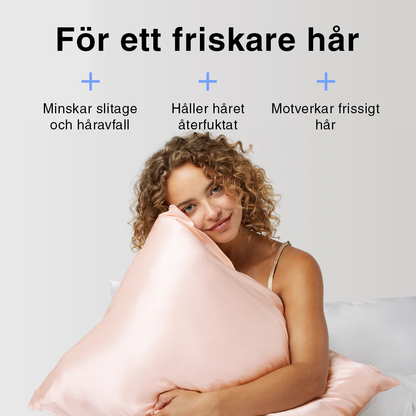 Rosa sidenörngott i bäddad säng – mjukt, lent och skonsamt mot huden